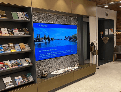 Infotainment-Digital-Signage-Inhalte an einem Host-Standort